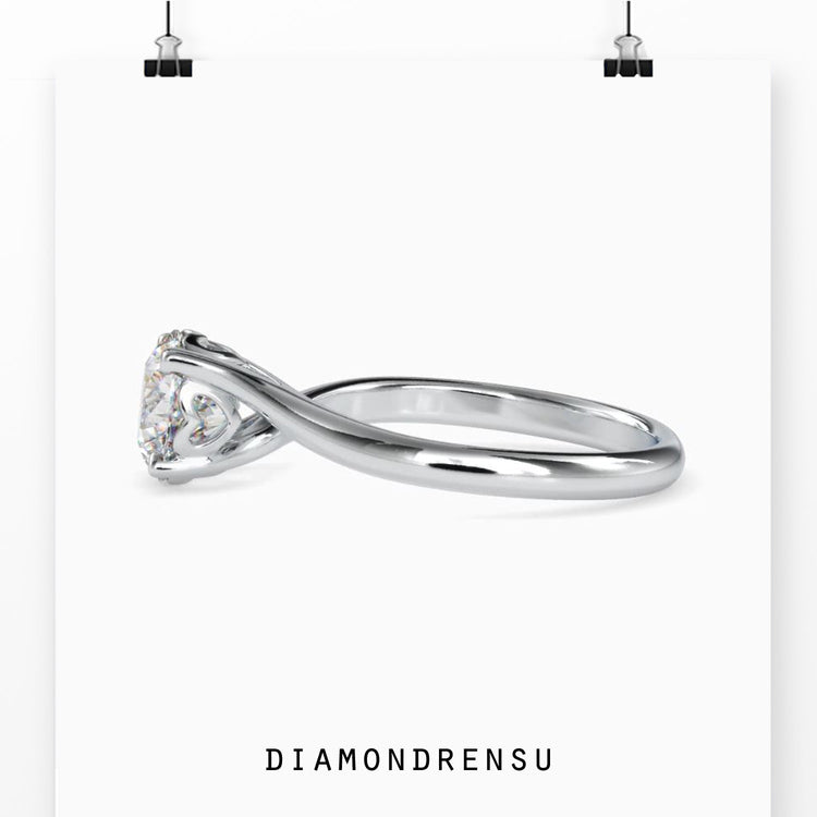 Yellow gold ring with bypass setting and round diamond.