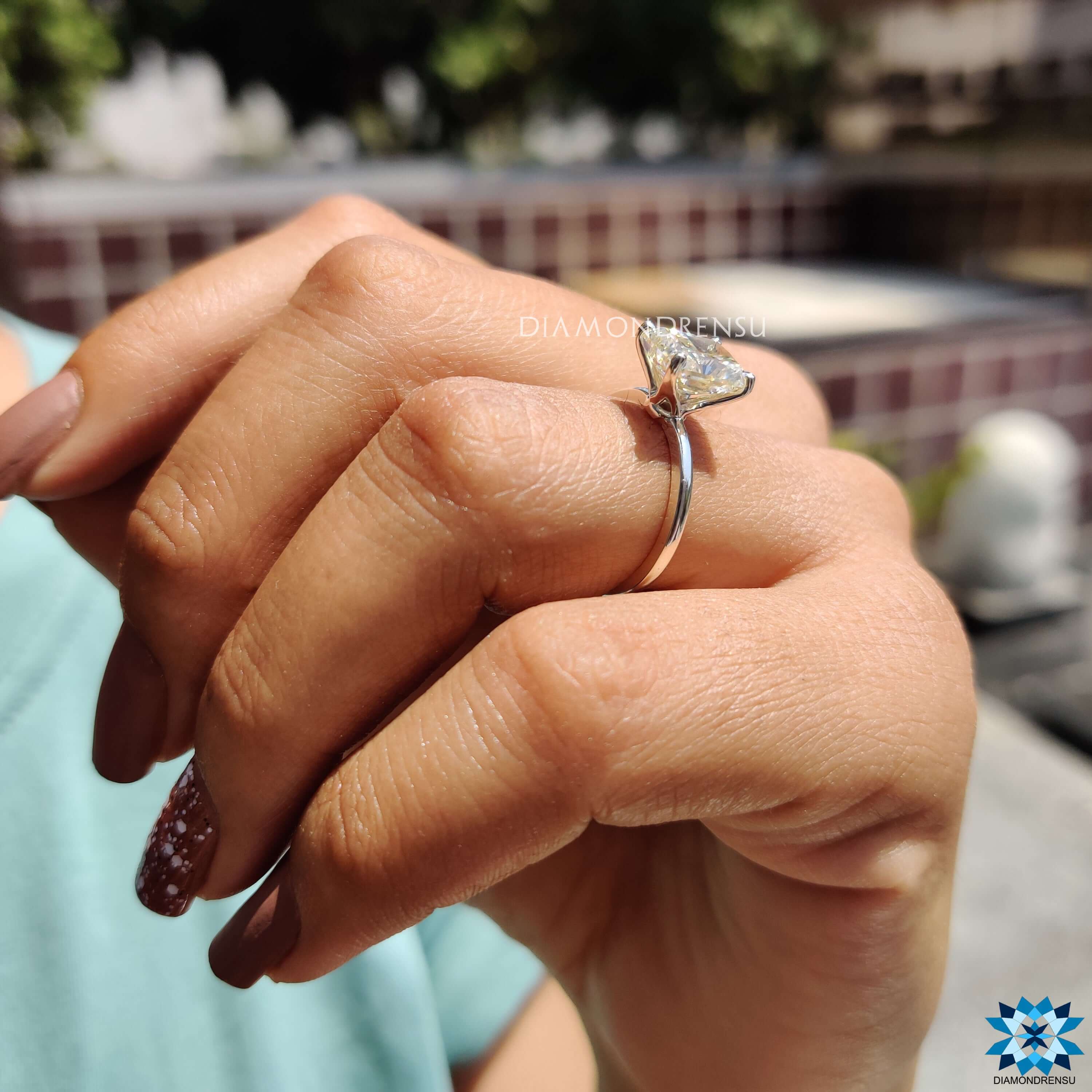 Solitaire setting ring with radiant cut moissanite in yellow hue from Diamondrensu UK.