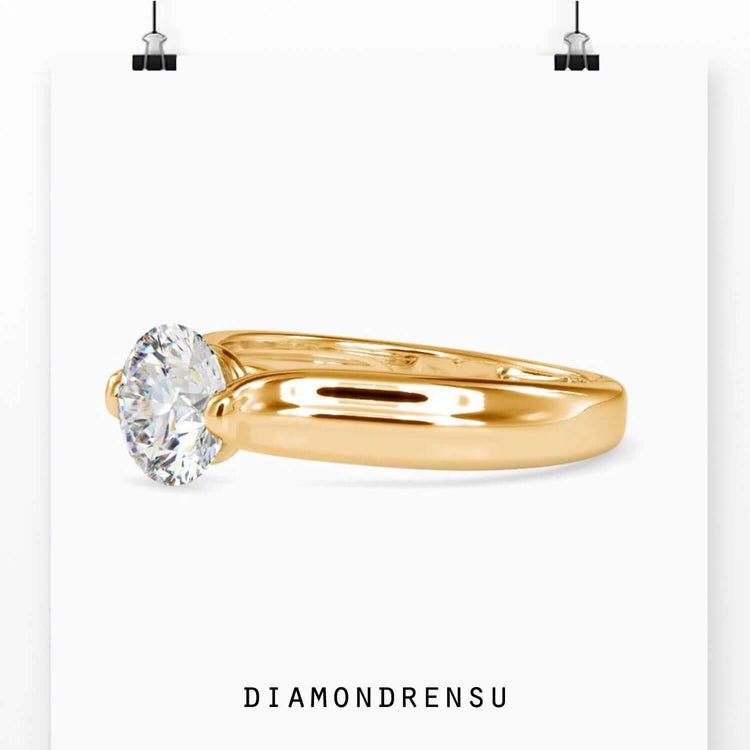 Rose gold engagement ring with round solitaire diamond, UK made.