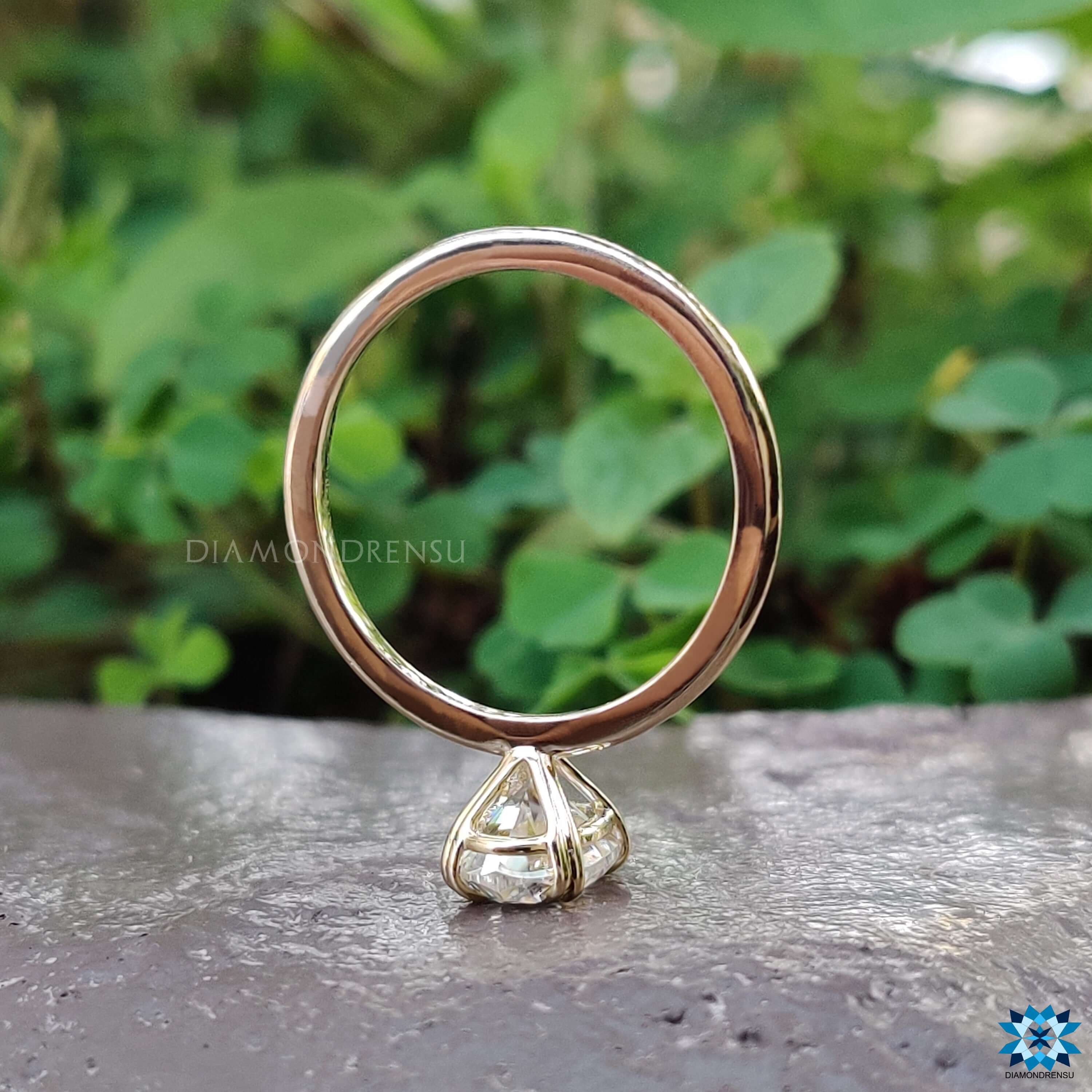 Handmade solitaire ring with oval moissanite stone.