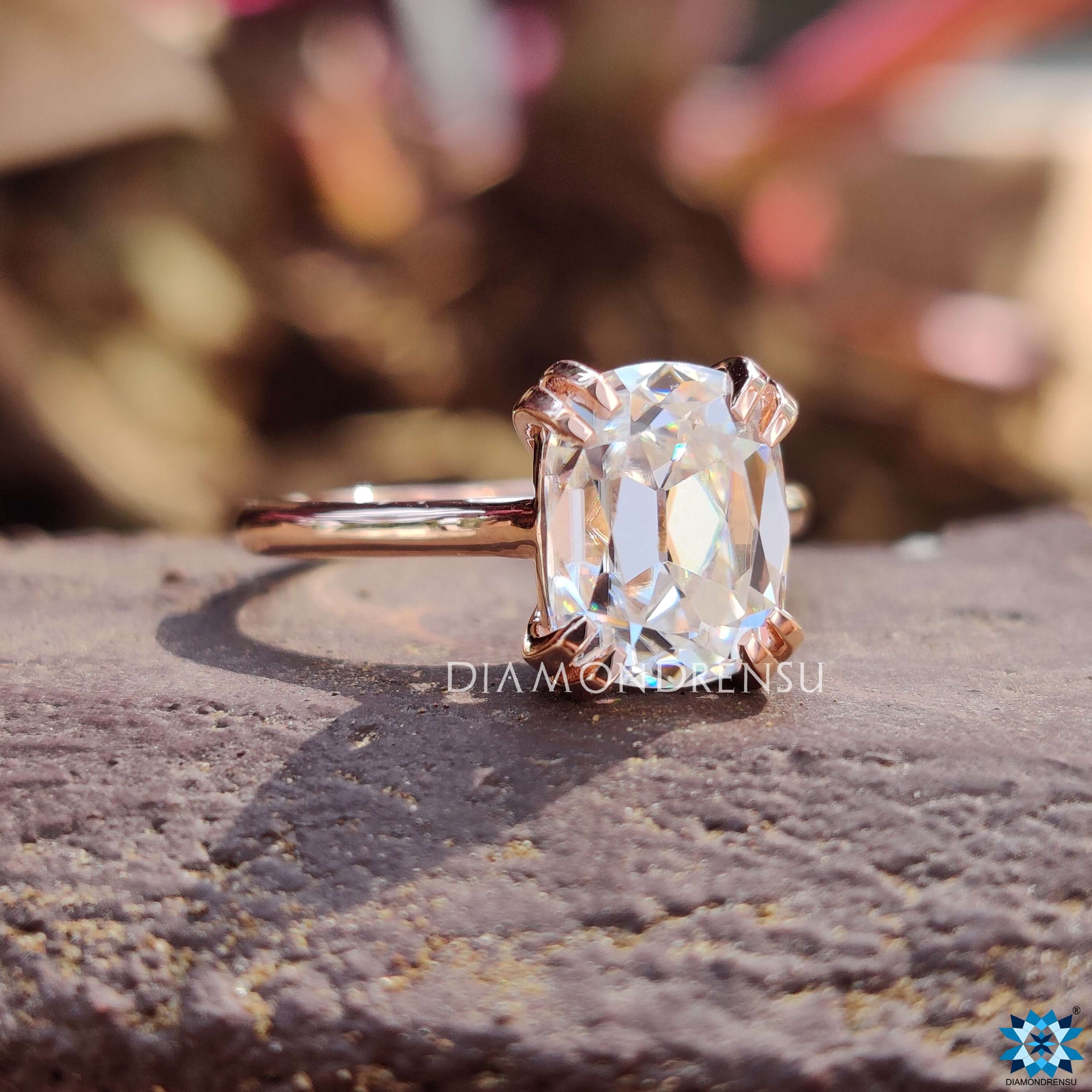 Handmade cushion OEC moissanite ring with prong setting.
