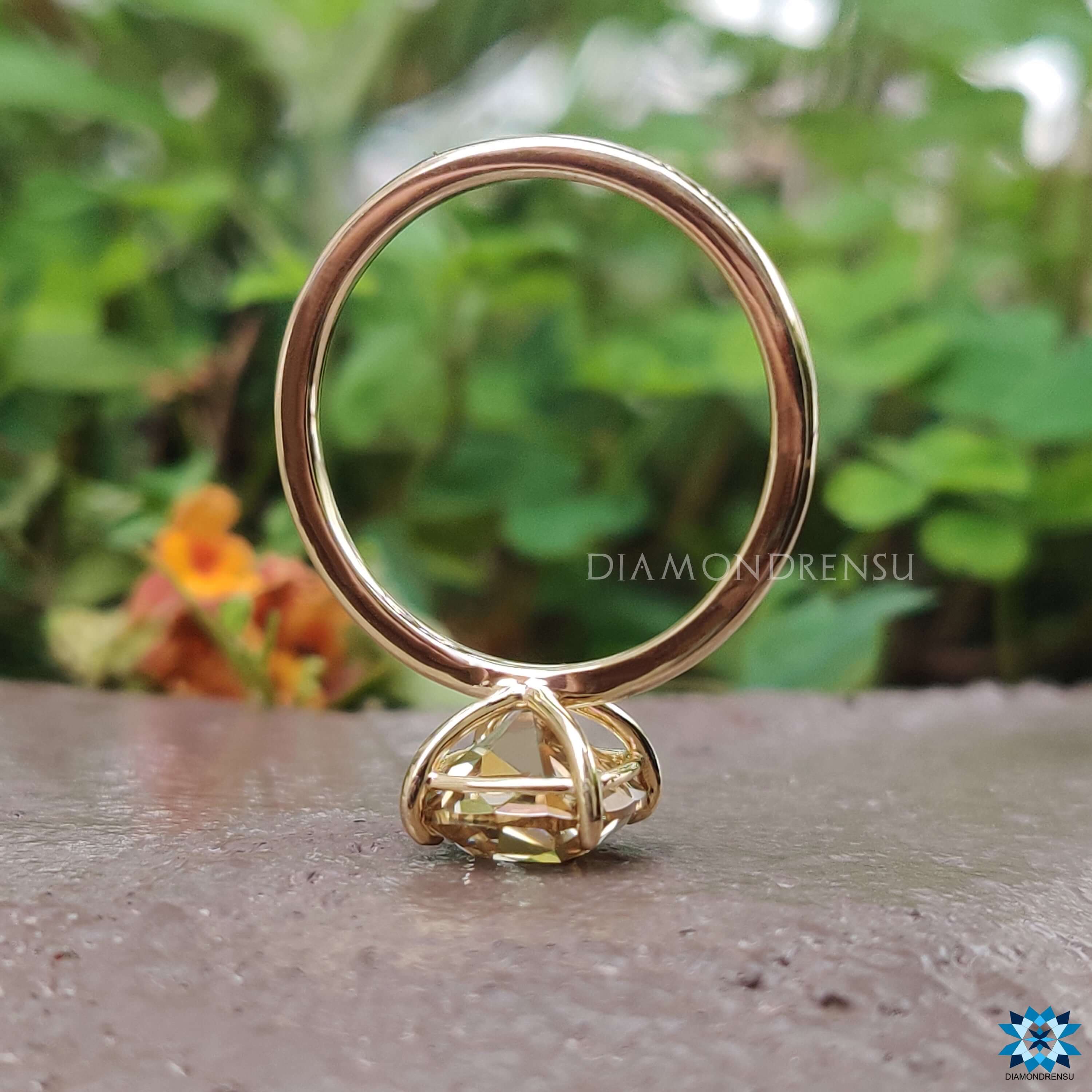 Diamondrensu UK yellow gold cushion cut moissanite ring.