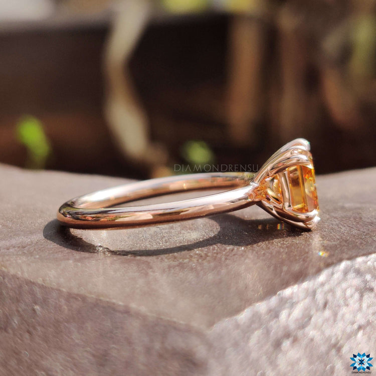 Champagne moissanite ring with double claw prongs.