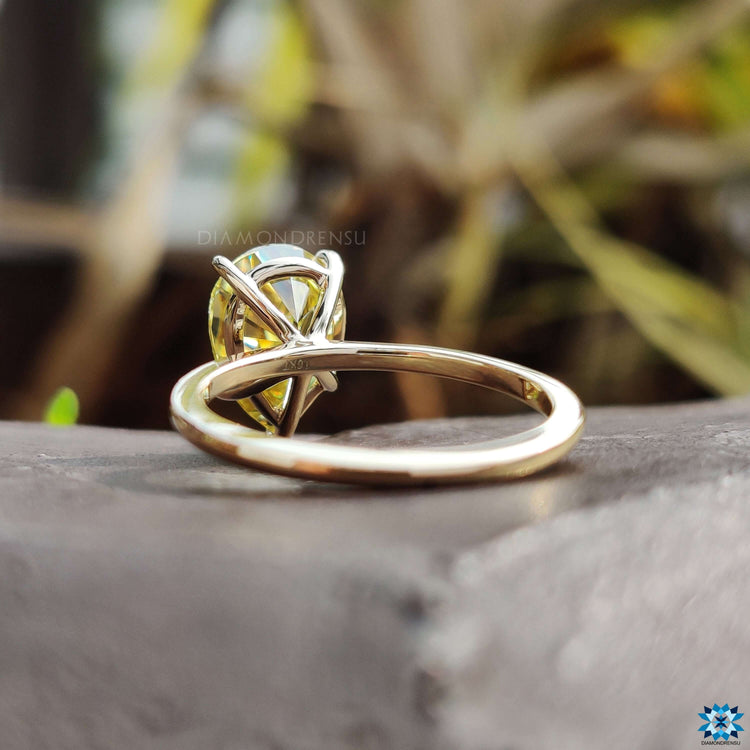 Custom engagement ring with yellow moissanite center.