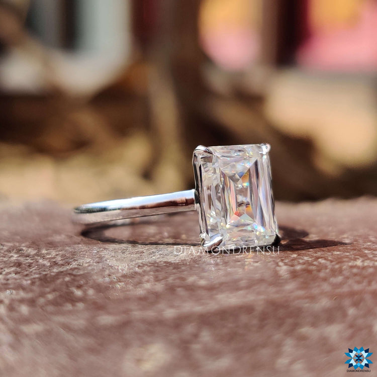 Simple solitaire engagement ring with criss cut moissanite.