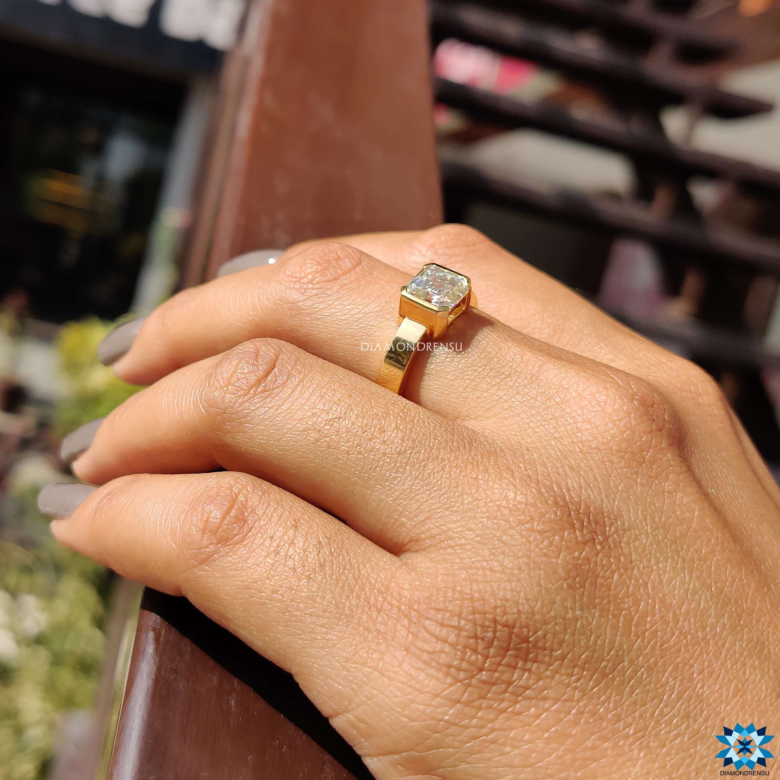 Buy Asscher cut moissanite ring in yellow gold.