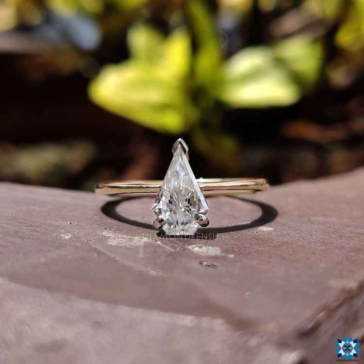 Simple moissanite ring with prong setting.