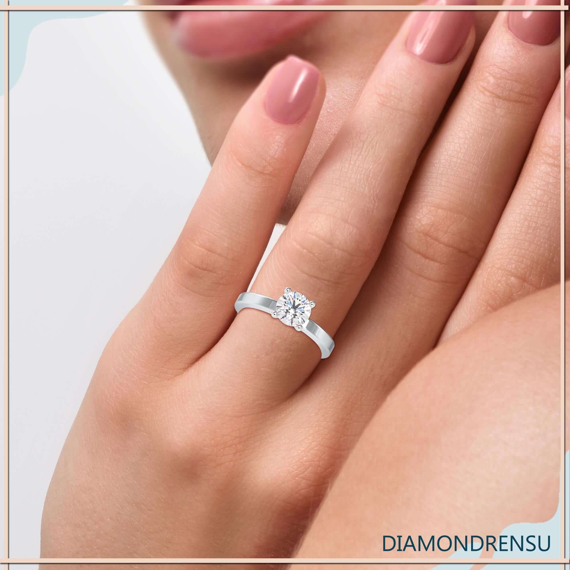 Round diamond ring in 4 prong solitaire design, handmade in the UK.