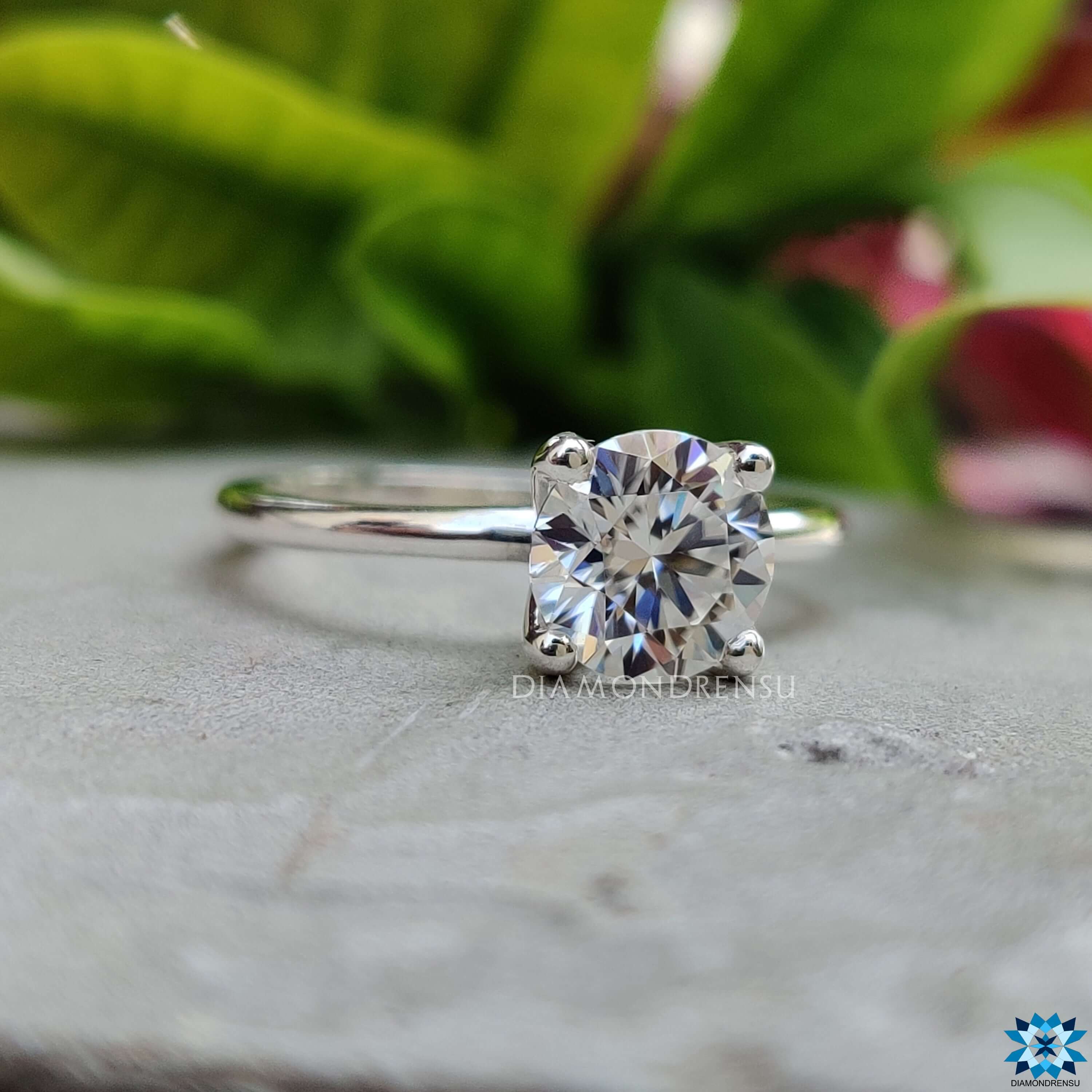 Handmade round cut moissanite engagement ring.