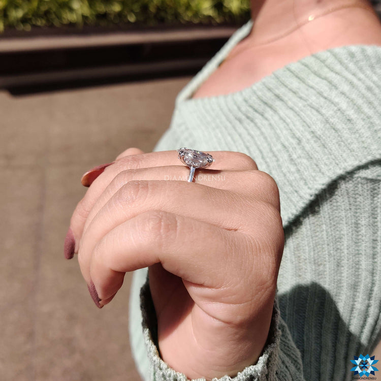 Handmade moissanite engagement ring in white gold.