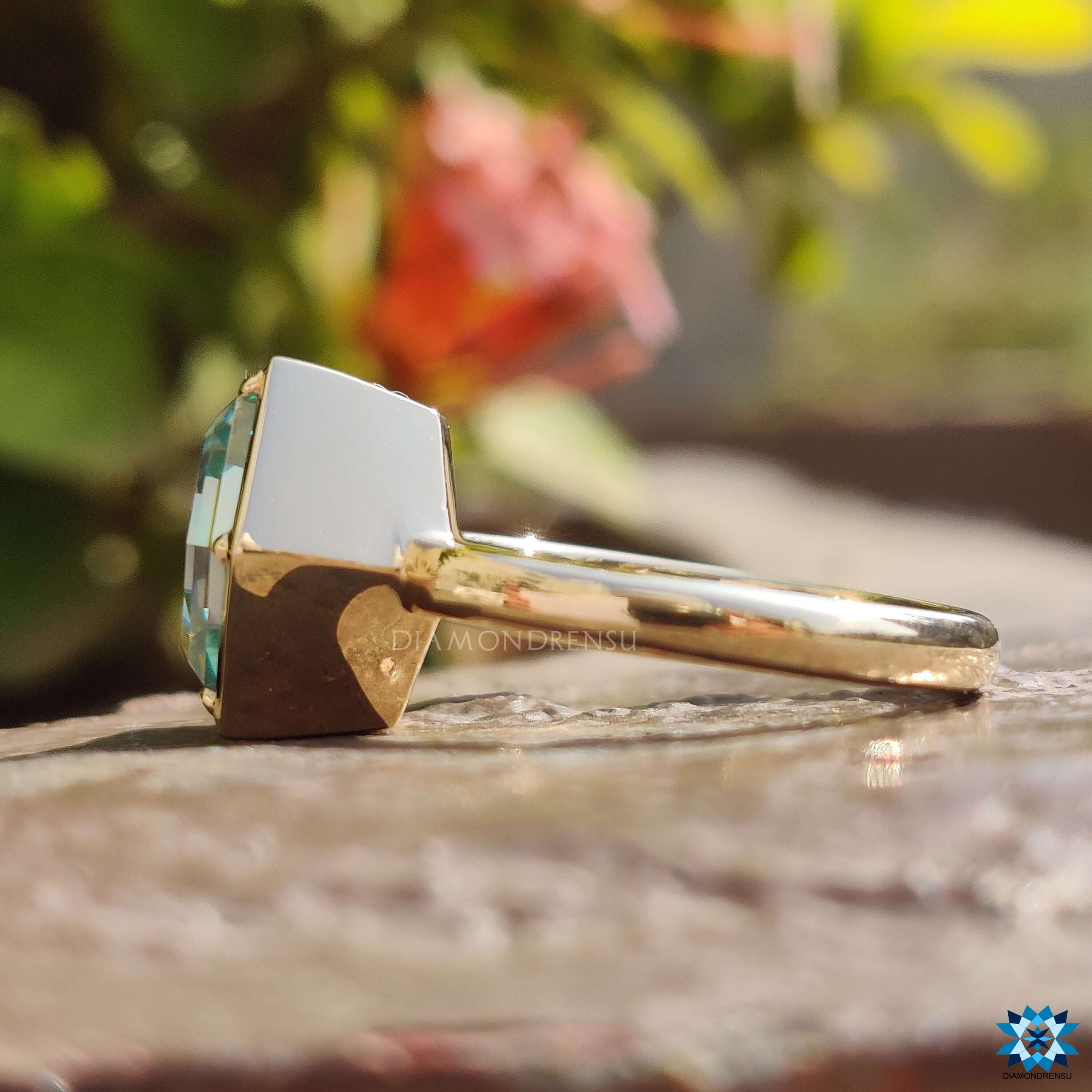 Diamondrensu UK handmade bezel solitaire moissanite ring in yellow gold.