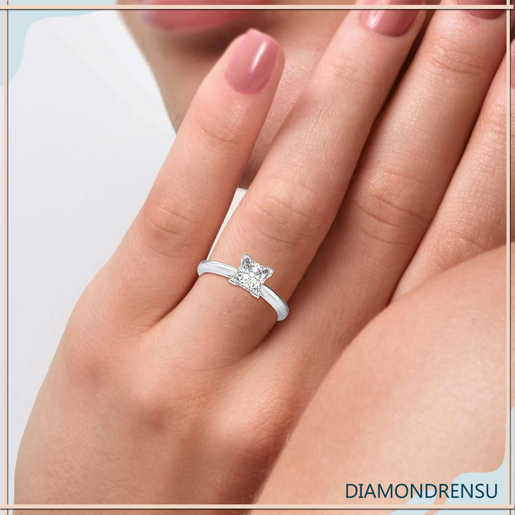 Lab grown princess cut diamond ring in yellow gold solitaire mount.