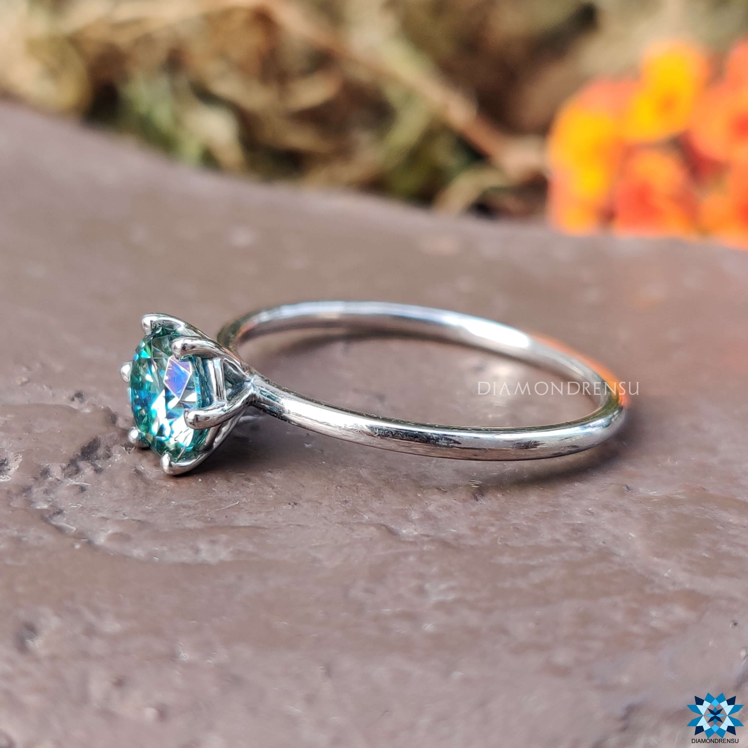 Handmade jewelry with cyan blue moissanite stone.