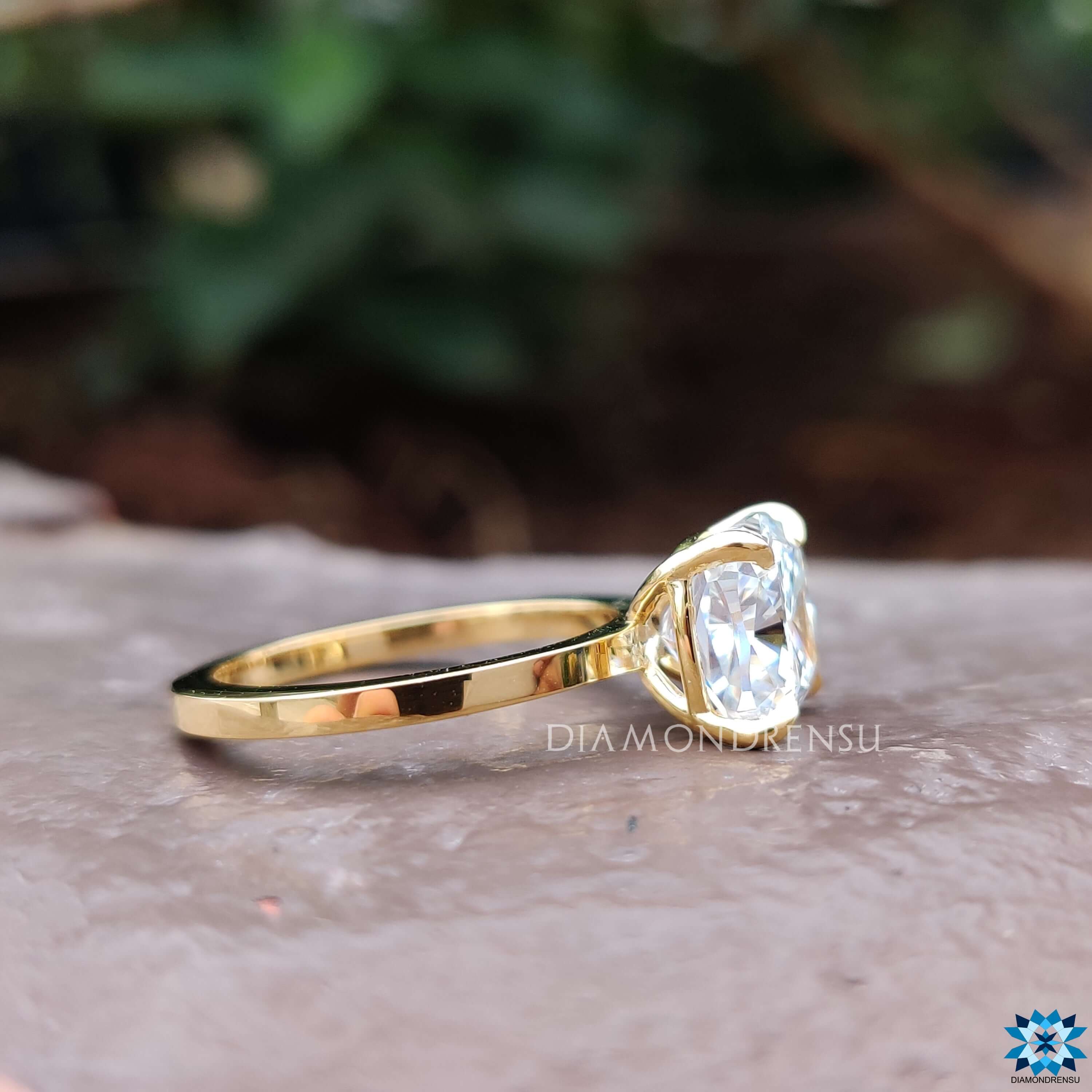 Buy moissanite ring with cushion cut stone in a simple solitaire style.