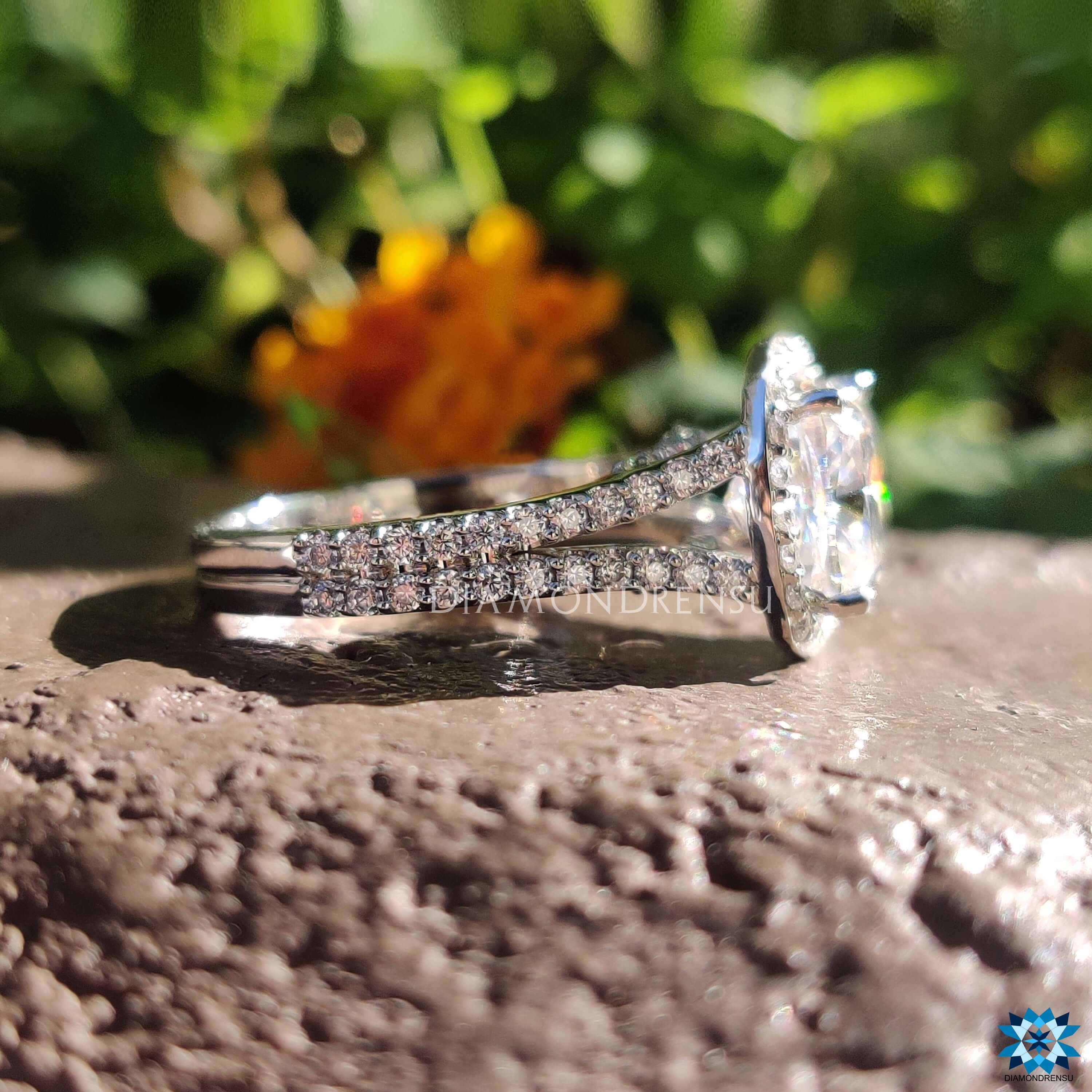 Handmade cushion engagement ring with split shank band.