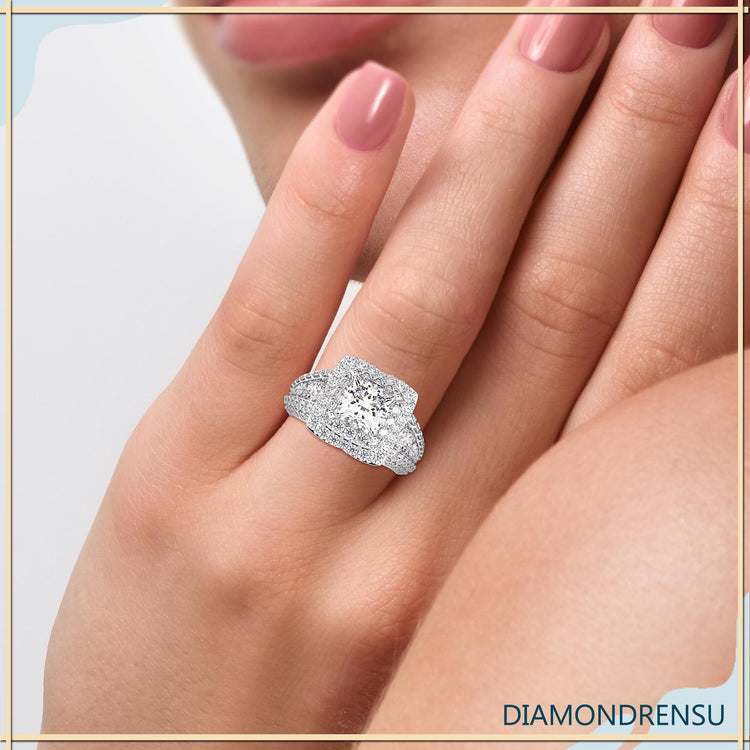 Double halo engagement ring with pave side diamonds.