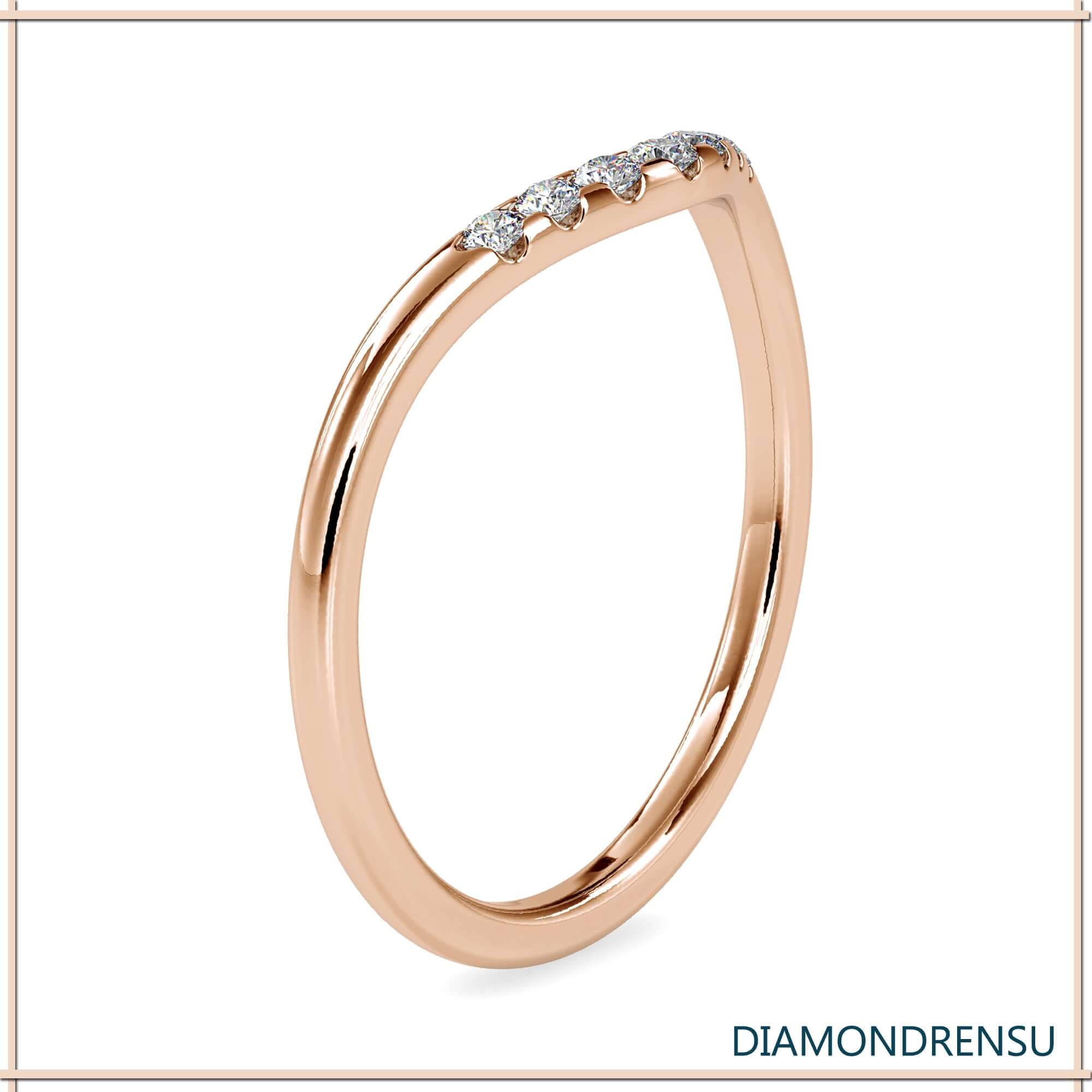 White gold wedding band with round diamonds.