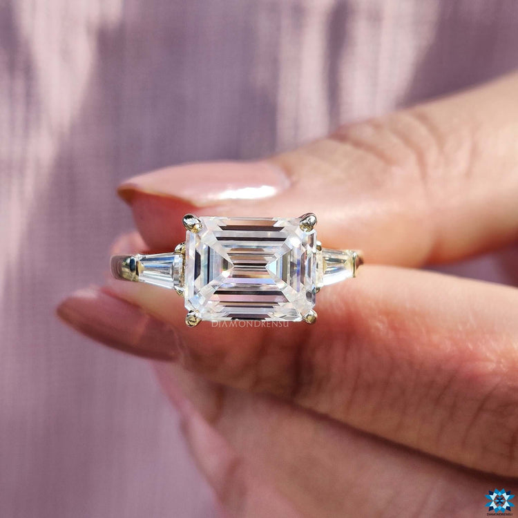 Yellow gold moissanite ring with prong setting.