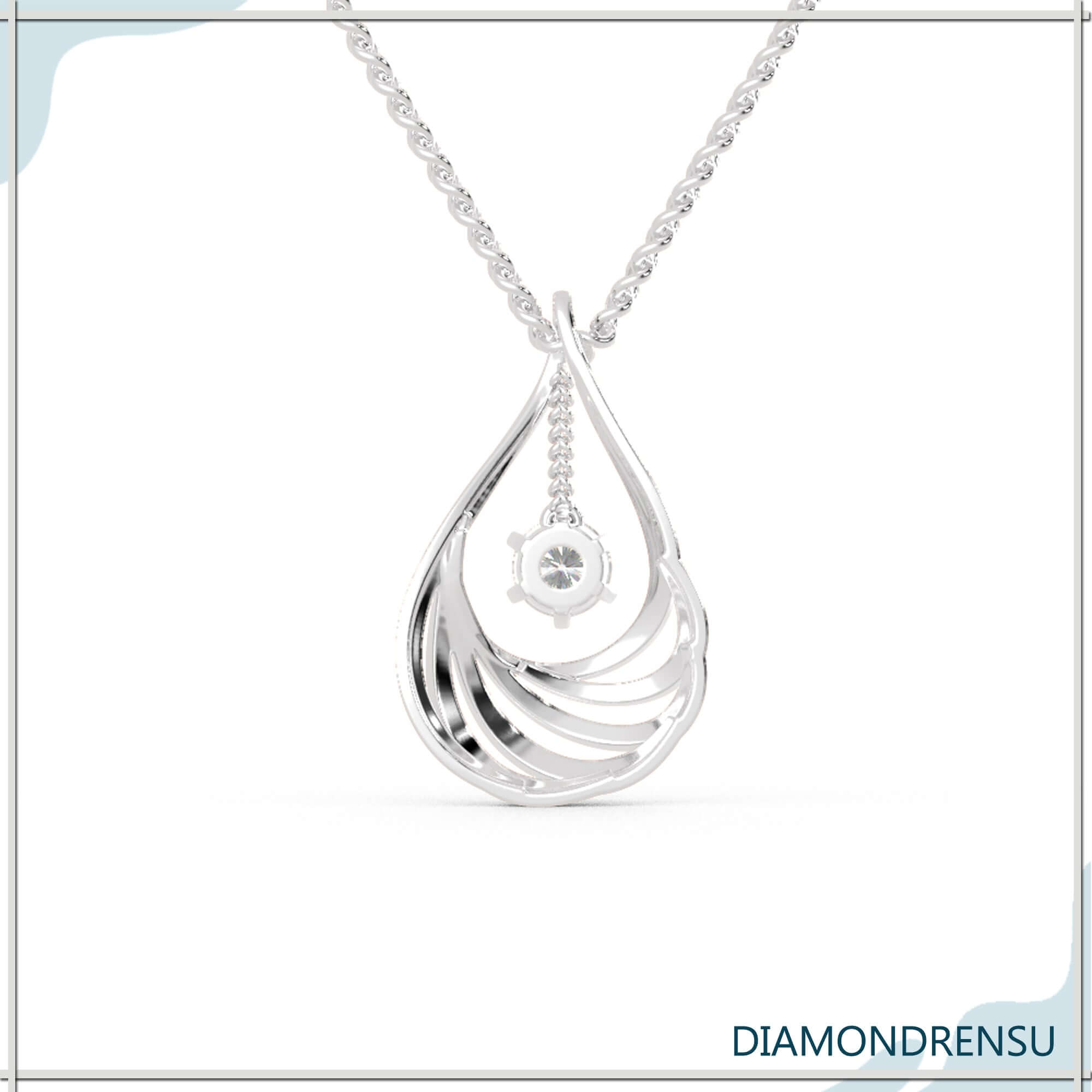 Round diamond gold pendant in sunburst halo and teardrop design.