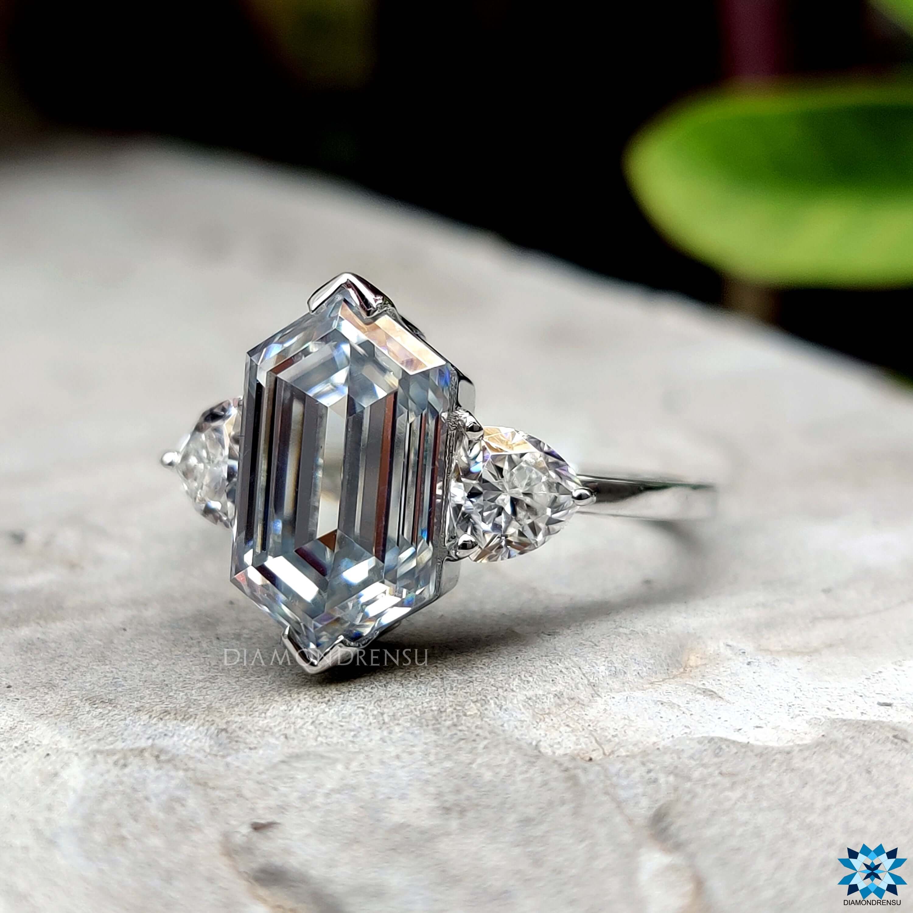 Unique hexagon moissanite ring with side trillion stones.