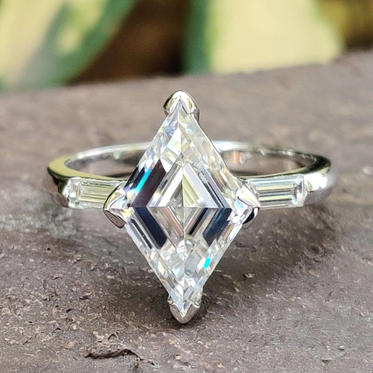 Lozenge cut moissanite engagement ring in white gold.