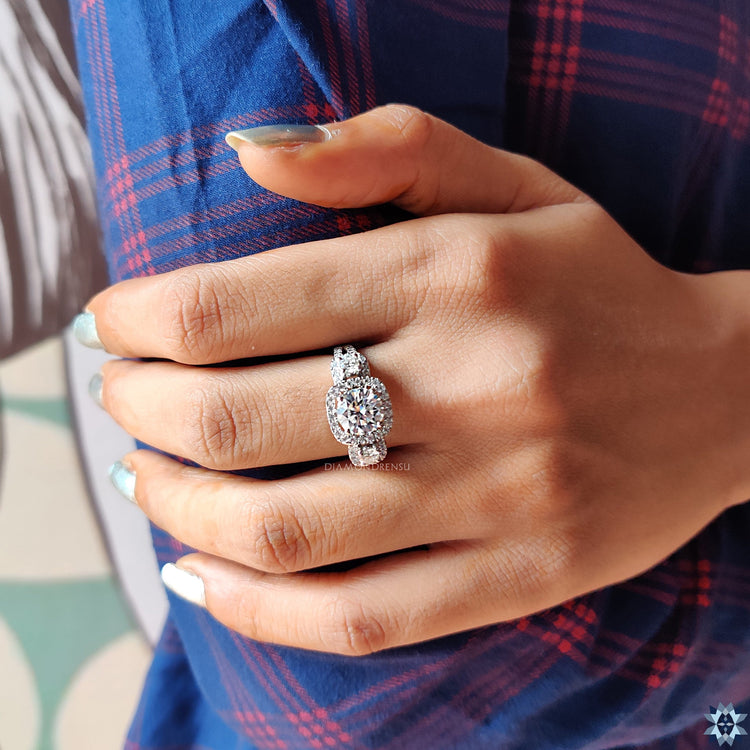 4 prong setting ring featuring round cut moissanite.