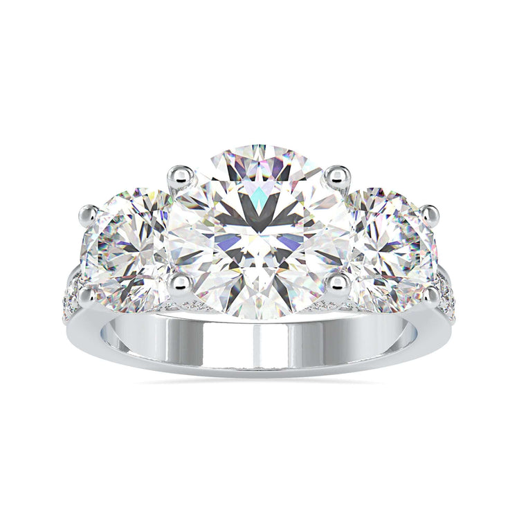 3 stone engagement ring with round diamond centre and side stones.