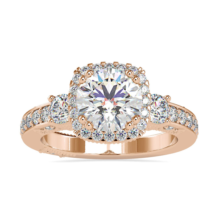 Custom design ring in rose gold with 3 round diamonds.