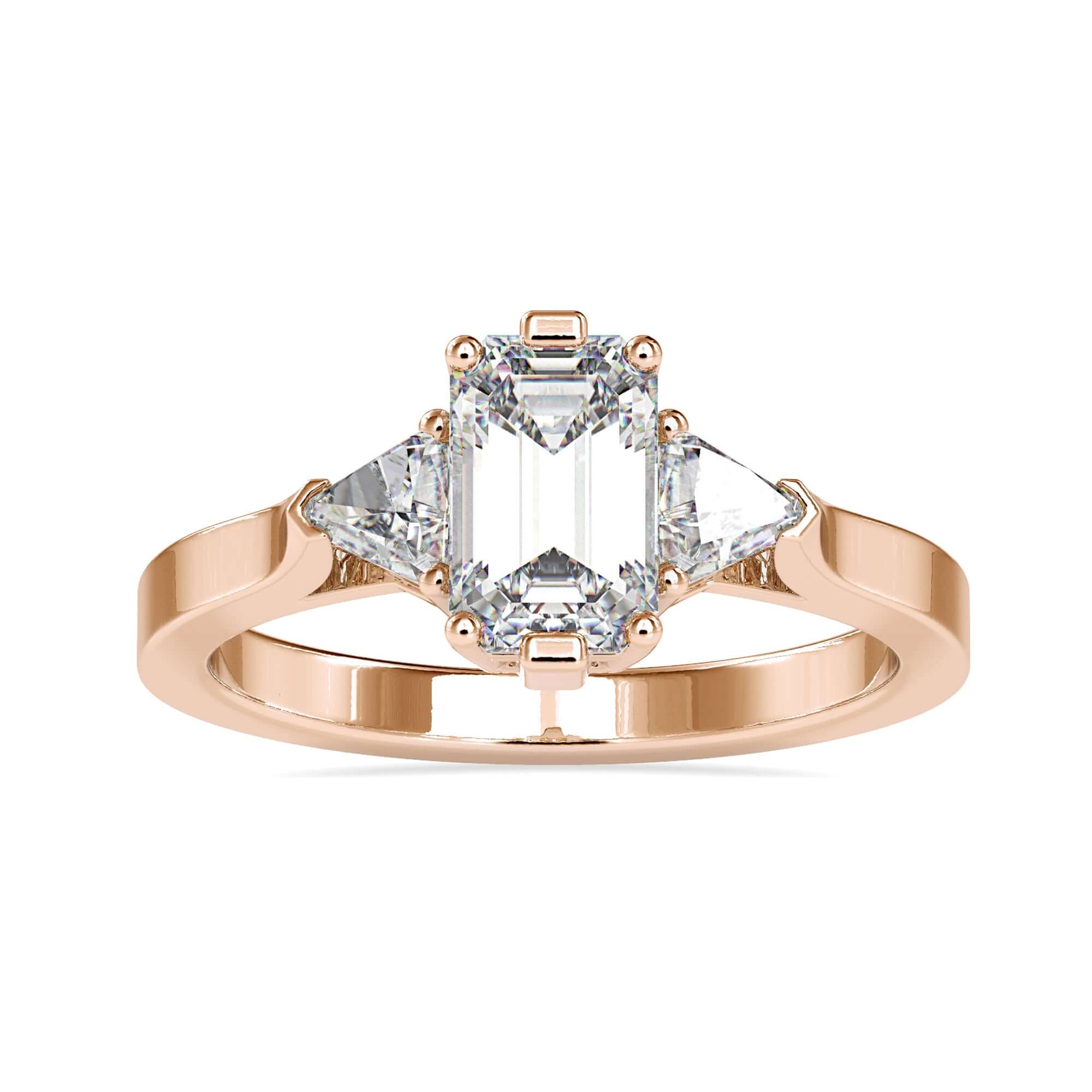 UK engagement ring with emerald cut and trillion sides.