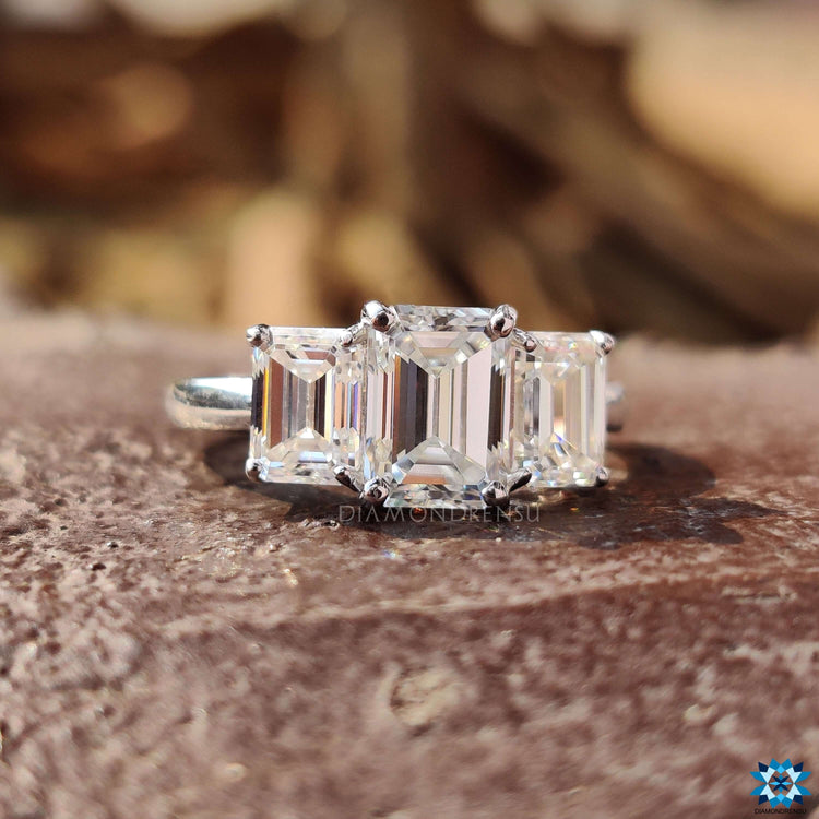 White gold ring featuring emerald cut moissanite.