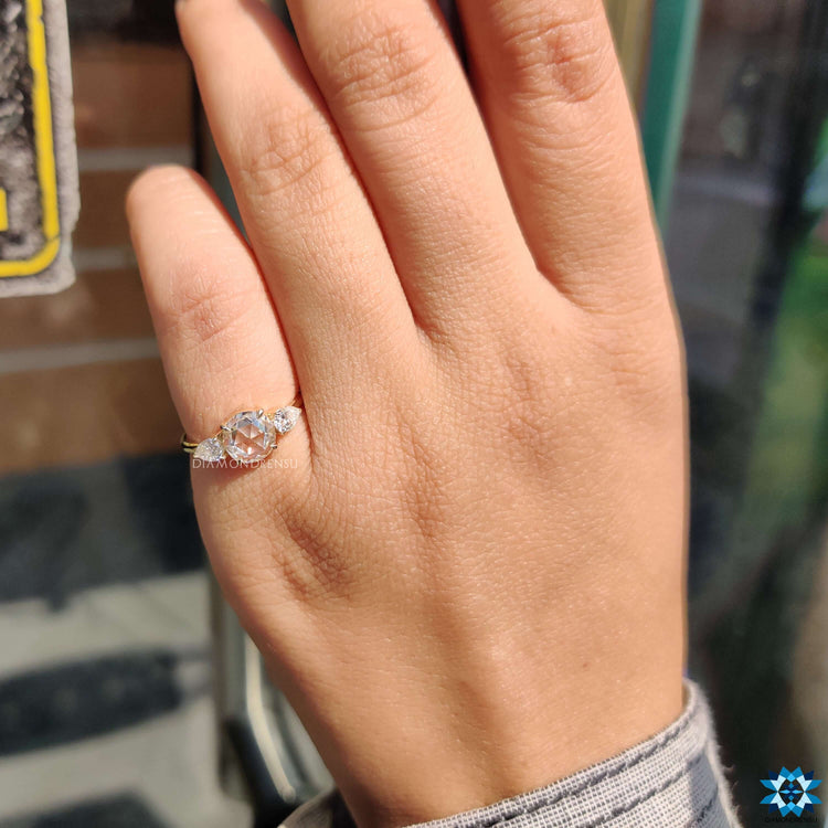 Rose cut moissanite engagement ring in a three stone design.