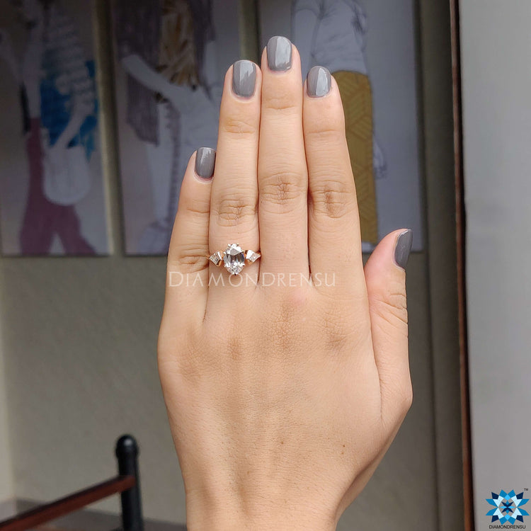 Rose gold ring with oval old European cut moissanite.