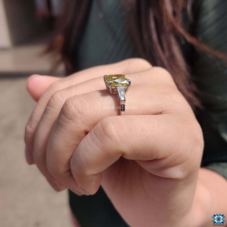 White gold prong setting ring with cushion cut stone.