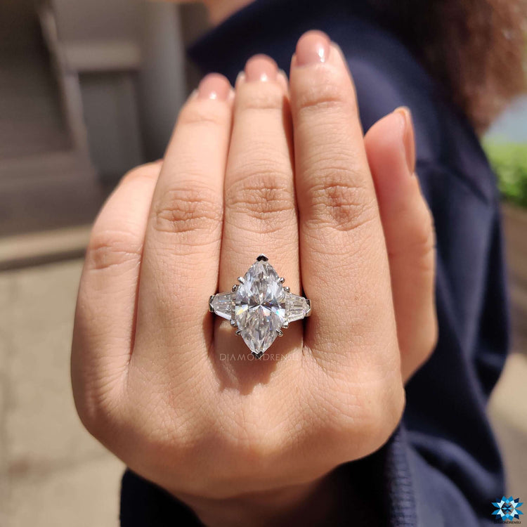 White gold ring featuring marquise and bullet cut moissanite combination.