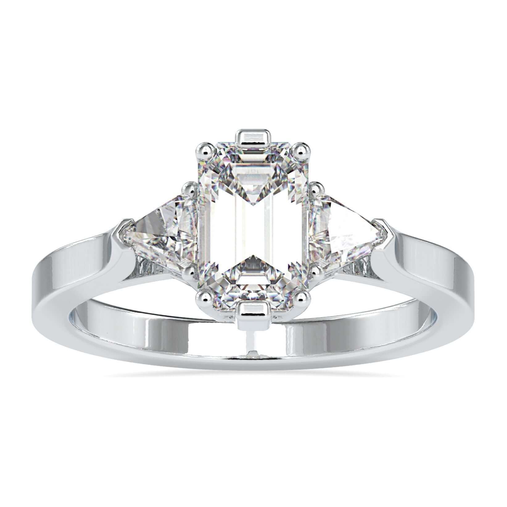 3 stone diamond ring with emerald cut centre and trillion sides.