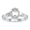 3 stone diamond ring with emerald cut centre and trillion sides.