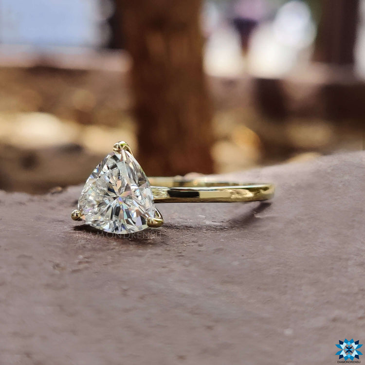 Yellow gold ring featuring trillion cut moissanite.