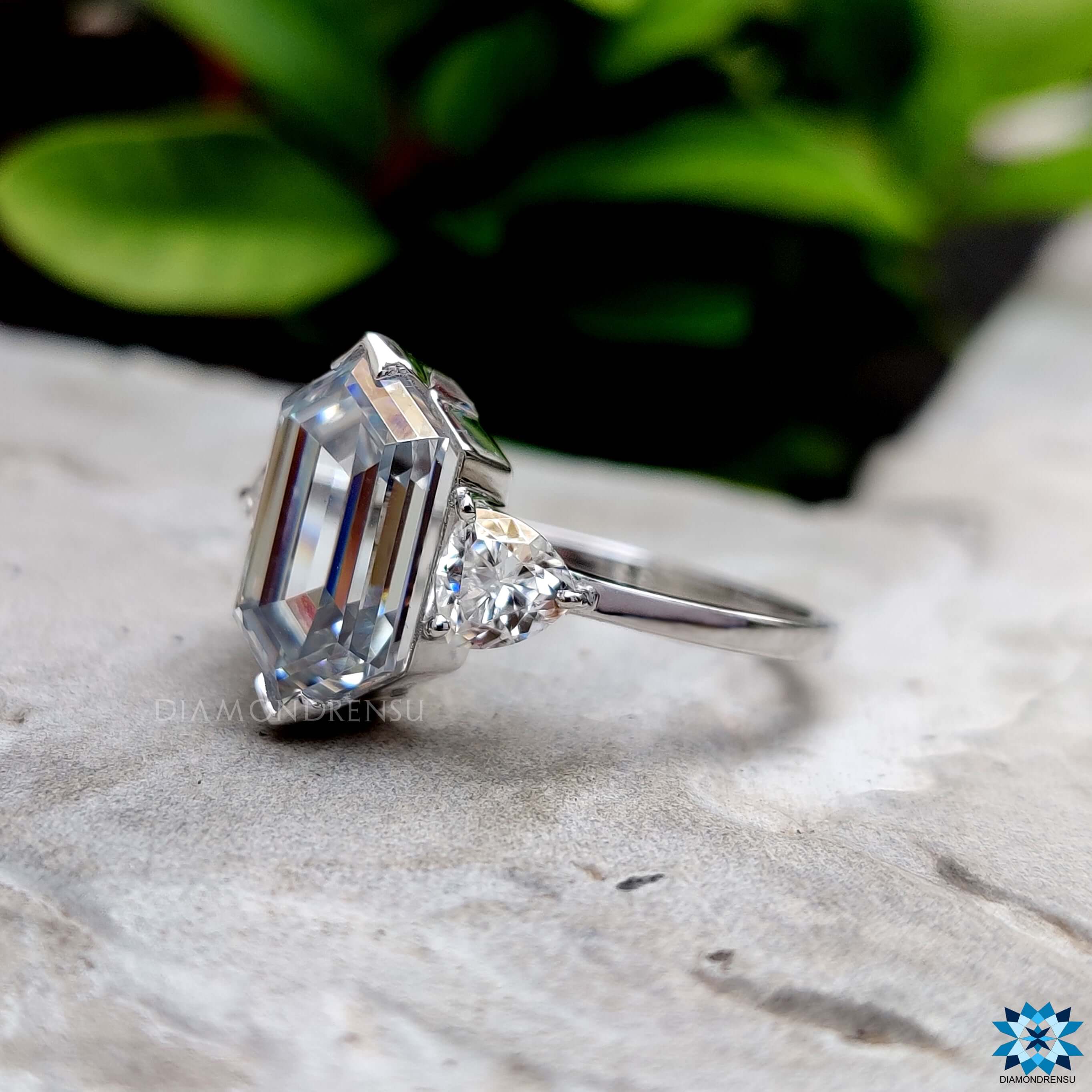 White gold hexagon cut ring with prong setting.