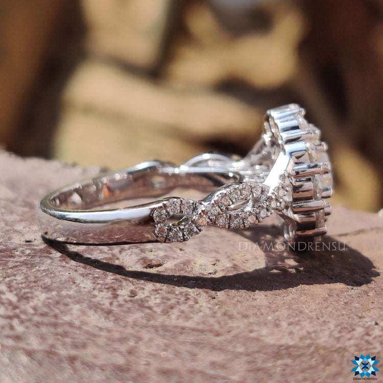 Moissanite halo ring with round cut stones.