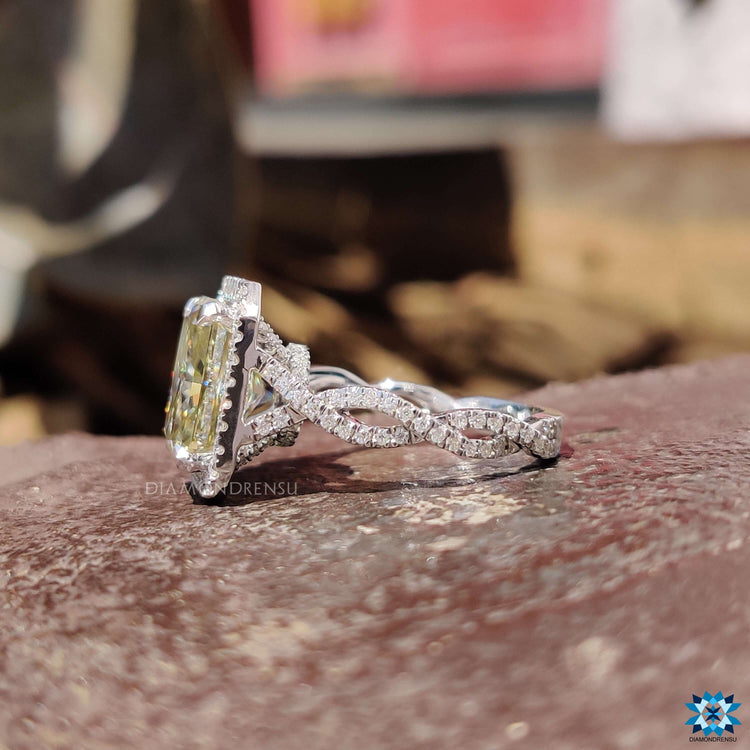 Custom radiant engagement ring in white gold setting.