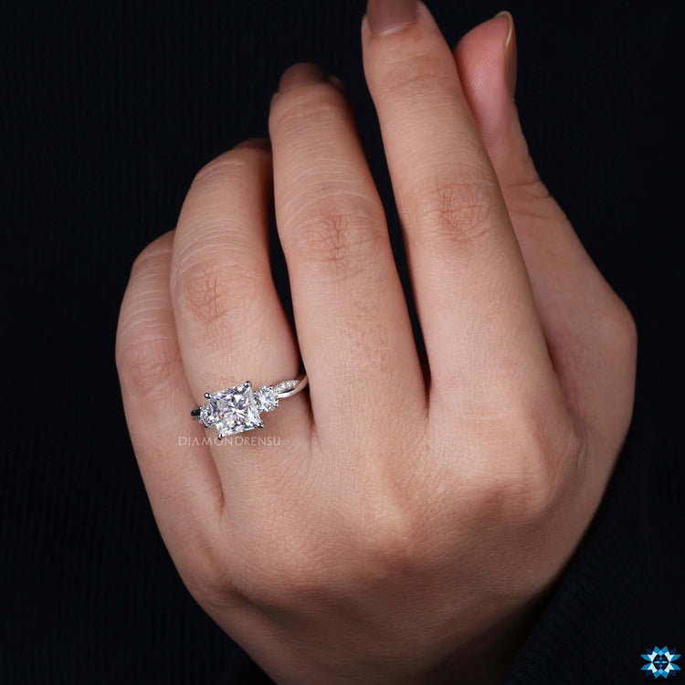 Handmade three stone moissanite ring.