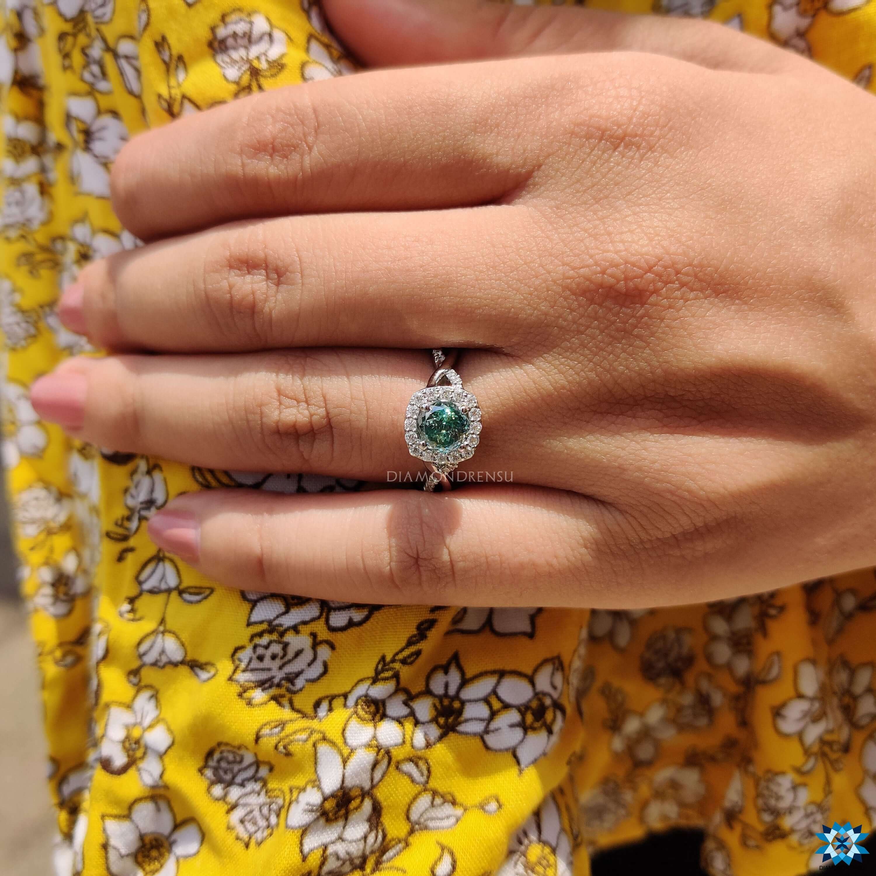 Custom moissanite ring in blue tone.