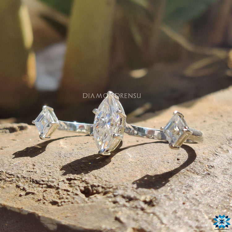 White gold moissanite two finger engagement ring.