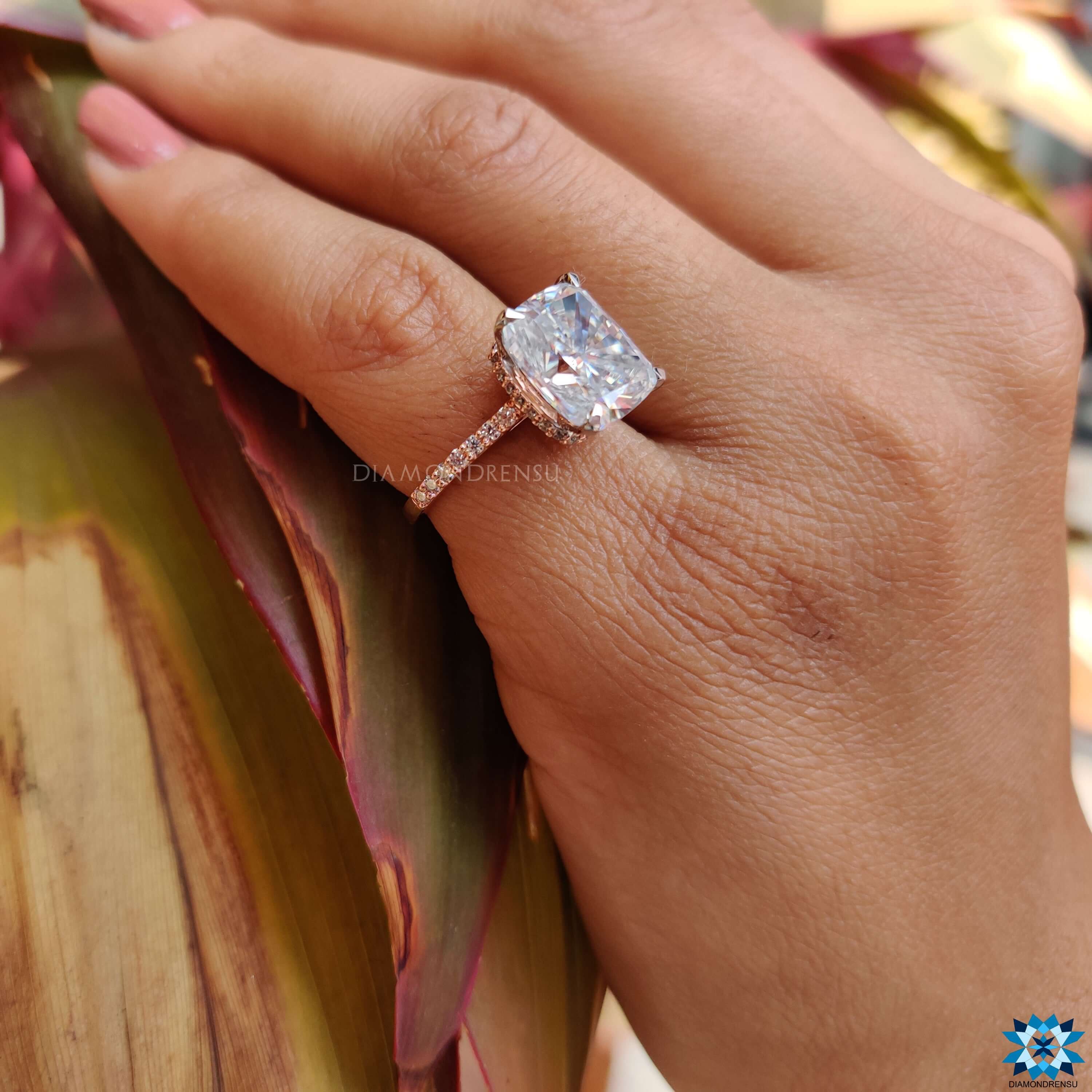 Two-tone moissanite ring in white and rose gold.
