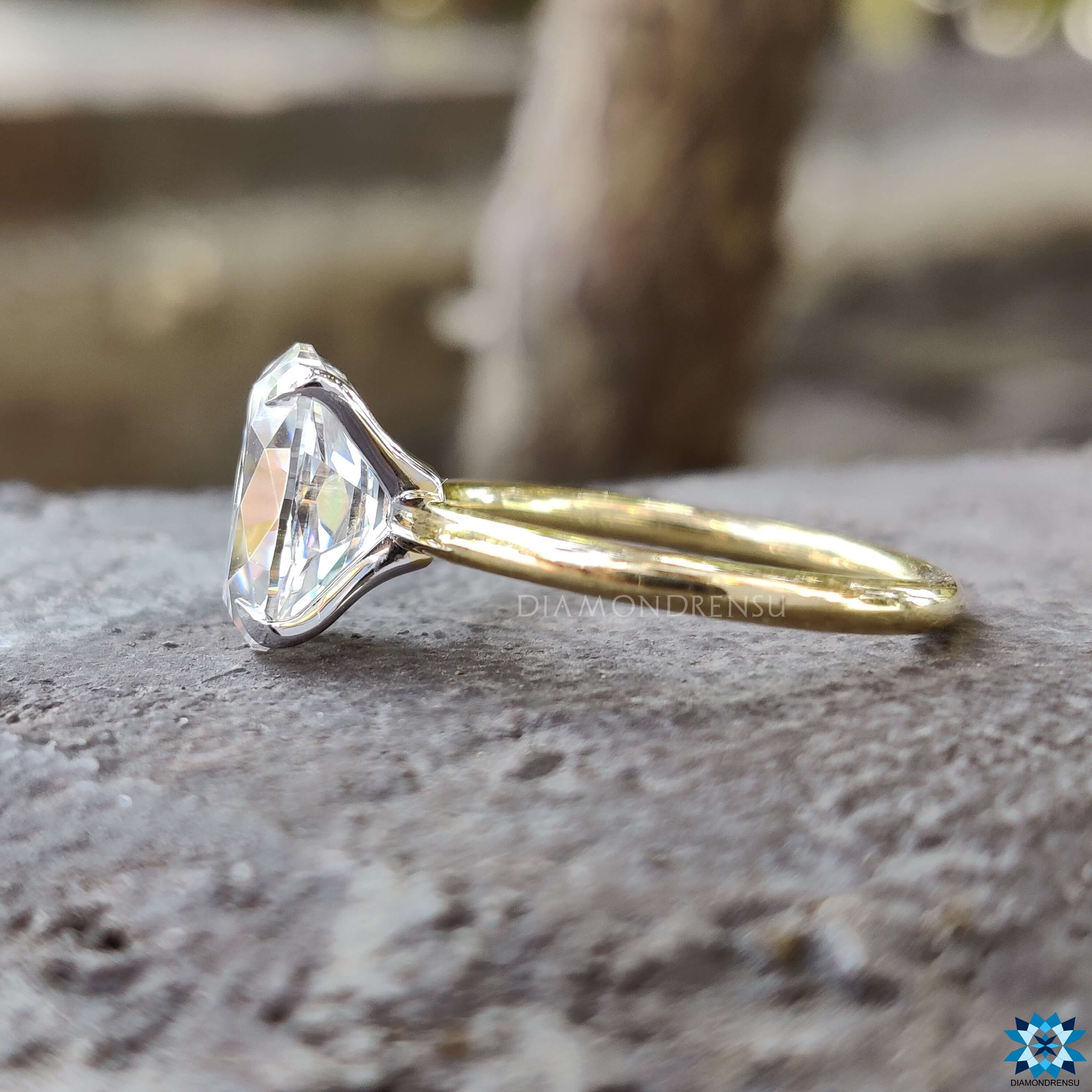Four prong setting on Moval cut moissanite ring.