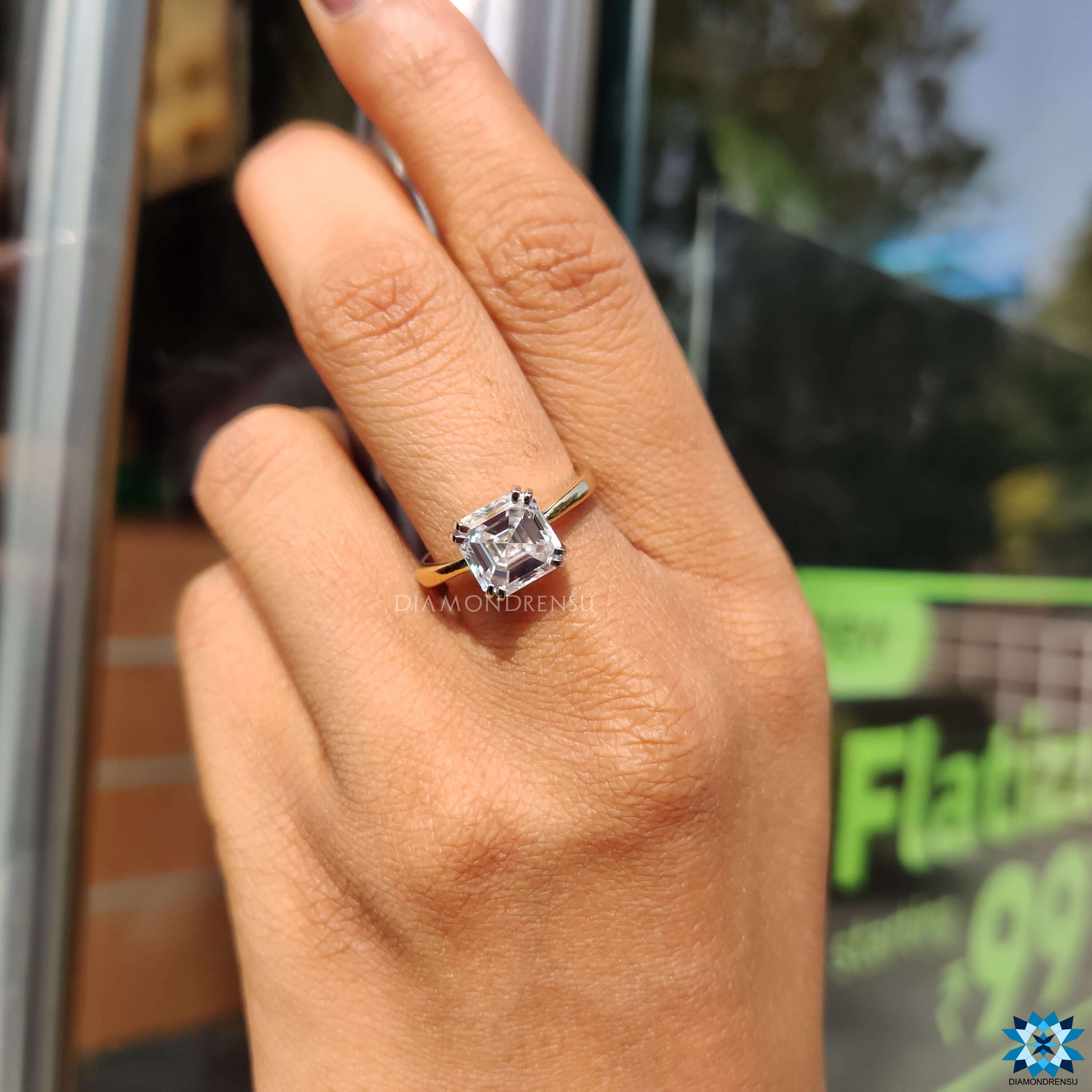 Yellow gold moissanite ring double prong engagement ring.