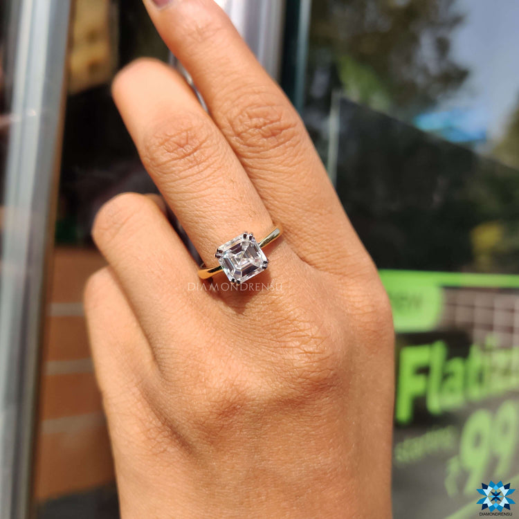 Yellow gold moissanite ring double prong engagement ring.