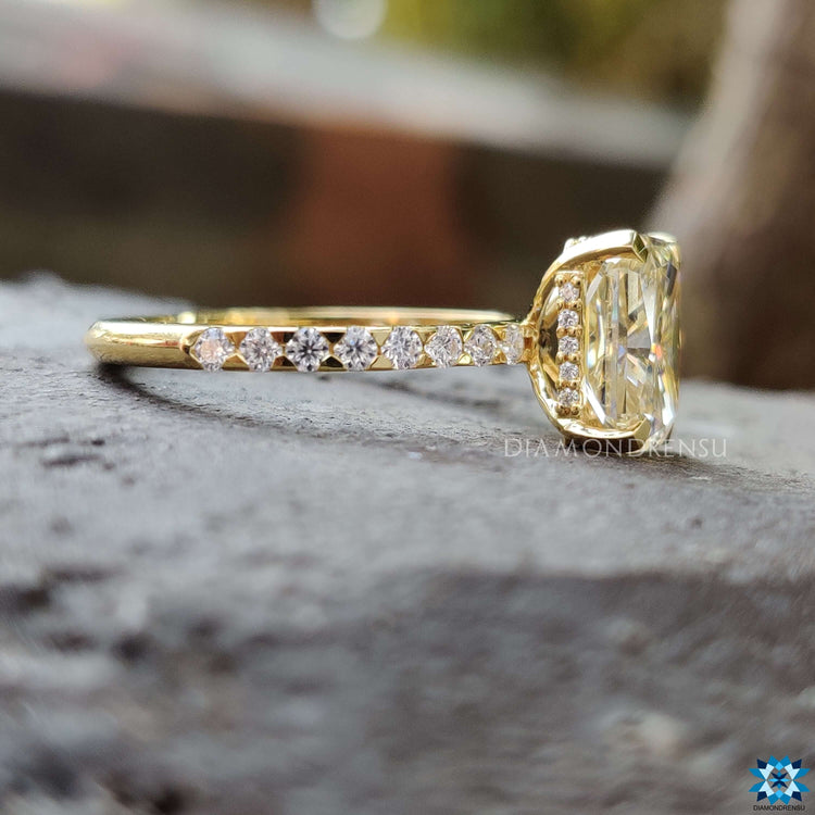 Light yellow gold radiant cut engagement ring.