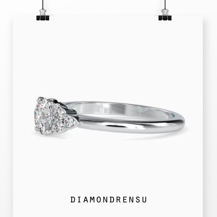 Rose gold ring featuring 7 lab grown diamonds in classic setting.