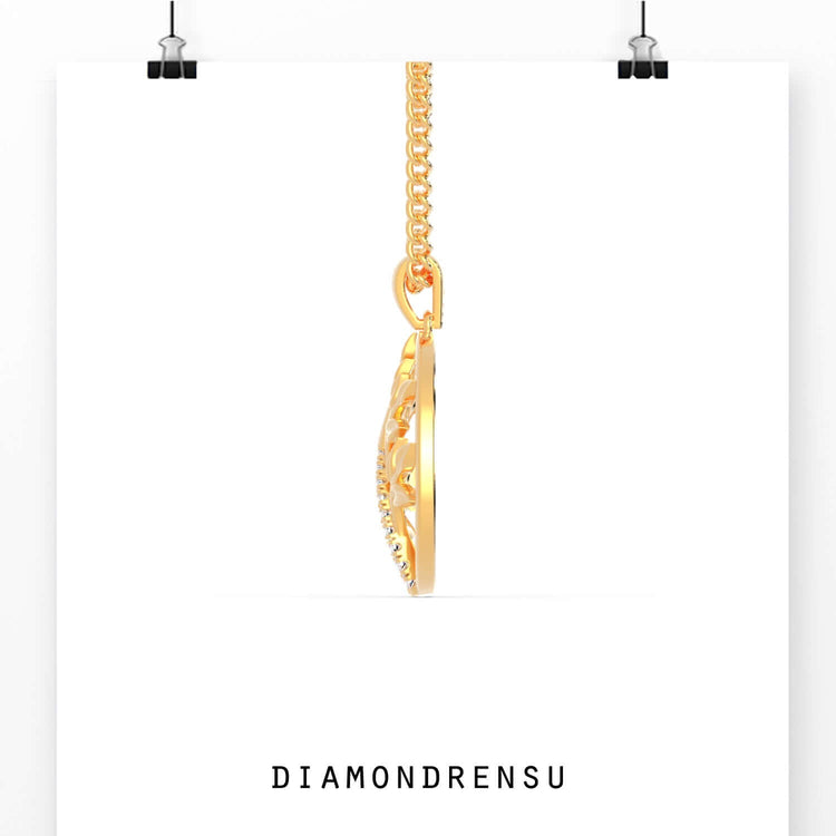 Round cut diamond pendant in tree of life style, gold finish.